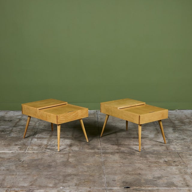 Pair of side tables by John Keal for Brown Saltman, c.1950s, USA. The Model 84 tables feature a dual-plane top. The...