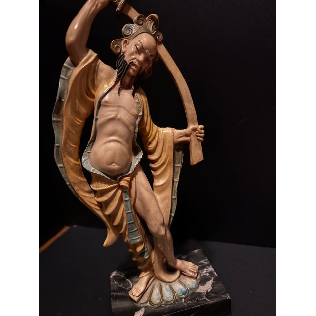 A Study in Harmony and Strength Bring an air of sophisticated intrigue to your bookshelf or mantle with this exquisite...