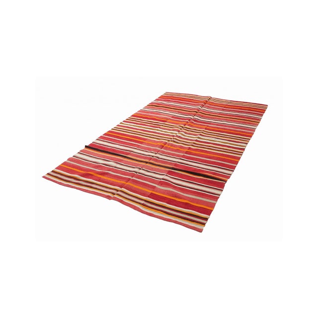 Handwoven vintage striped decorative kilim rug from Denizli region of Turkey. Approximately 50-60 years old. In very good...