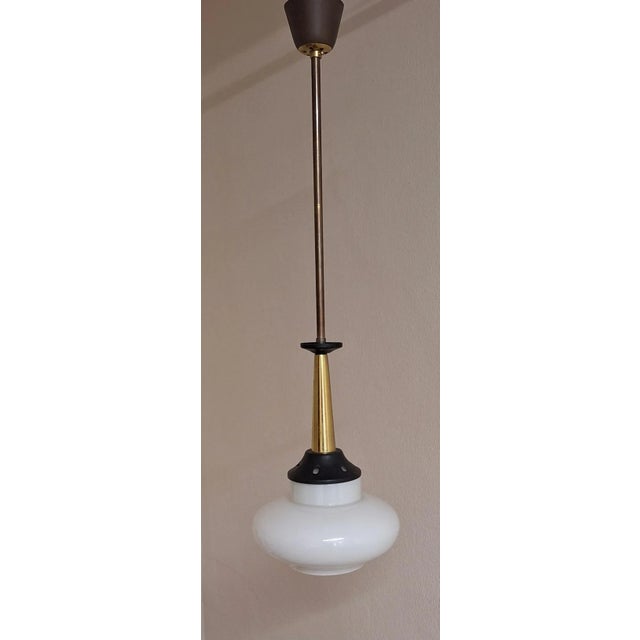 Mid-Century Brass and Black Lacquered Metal Ceiling Lamp with White Opaque Glass Shade, 1960s, in Very Good conditions....