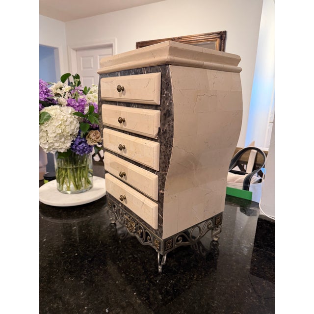 Vintage tessellated stone jewelry chest featuring an elegant bombe silhouette, brass hardware, and an ornate iron base....