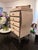 Vintage tessellated stone jewelry chest featuring an elegant bombe silhouette, brass hardware, and an ornate iron base....
