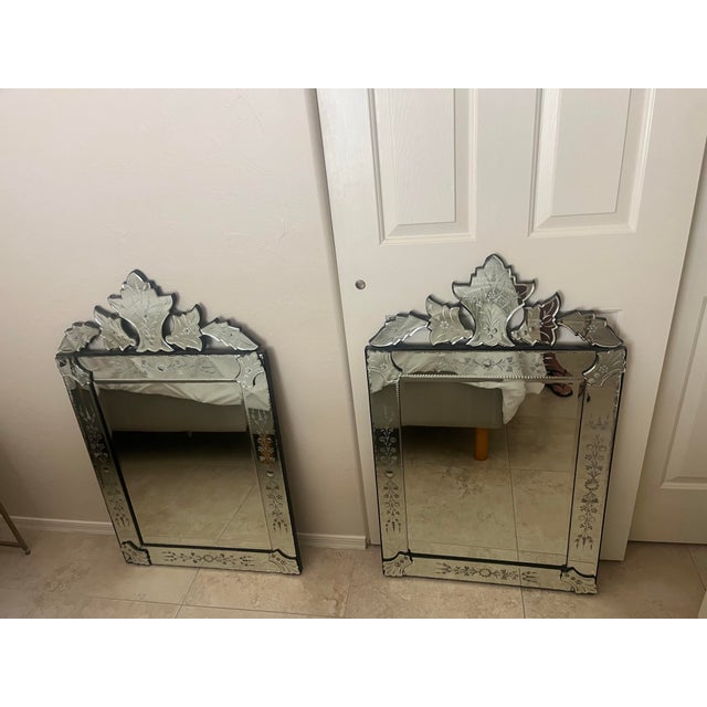 This item is a vintage Venetian style wall mirror featuring traditional etched glass floral designs and ornate, beveled...