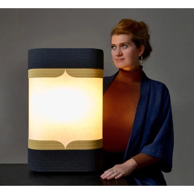 Kensho light by astrid hauton dimensions: w 37 x d 18 x h 59 cm materials: woven washi paper, waxed black valchromat,...