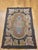 This distinctive Vintage American hand-hooked rug, crafted in the early 1900s in the New England region, is a beautiful...