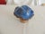 Decorative Hand-Painted Ceramic Mushroom. Painted blue and brown. Glazed crown and hand-painted brown stem. Size: 6'D x...