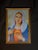 Framed religious portrait artwork featuring a classic devotional Sacred Heart style image with vivid blue, white, red, and...