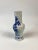 Blue and white floral Qing Dynasty (19th C) hand painted porcelain vase. There are some areas that have been repaired.
