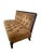 Tufted suede leather upholstered front and back with brass nailheads along a wood framed body. Wood spindle legs with...