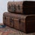 A pair of vintage rattan suitcases, Thailand, circa 1950s. Larger measures 22 ¼ inches wide by 13 inches deep by 7 ½...