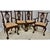 Late 20th Century Chippendale Hand Carved Mahogany Dining Chairs -Set of 8. The chairs feature Lion's Main legs, Ball and...