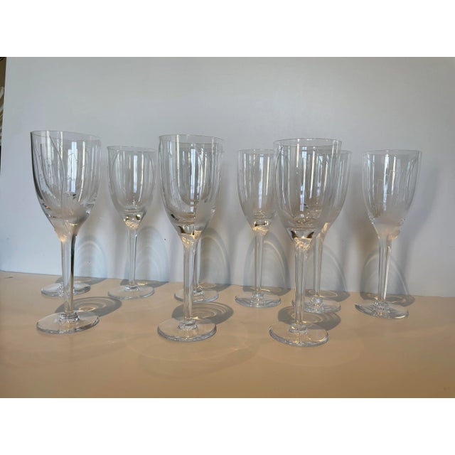 Nine vintage Lalique “Ange” Fluted Champagne Glasses. These are no longer made so this set it extraordinary in its...
