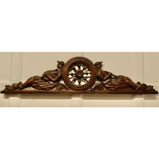 Bretton carved oak decorative pediment, over door A lovely carved oak Pediment from an item of French Furniture This piece...