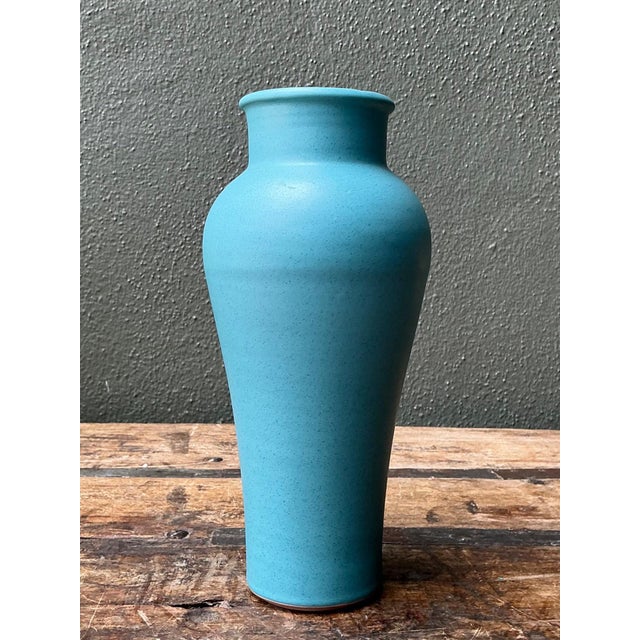 This vintage studio pottery blue ceramic vase is a refined example of mid-century artisan craftsmanship, distinguished by...