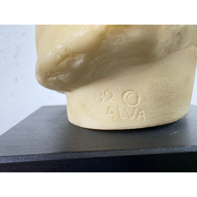 This is a vintage classical Greco-Roman style female bust. This classical bust is presented on a black plinth and was made...