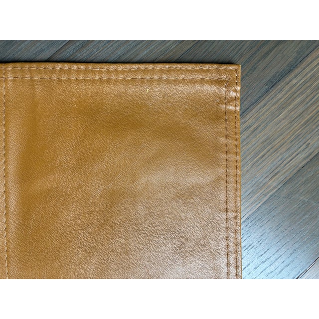 a set of 4 brown leather placemats each made of 6 square pieces with double stitched seams and edges. very fine smooth...