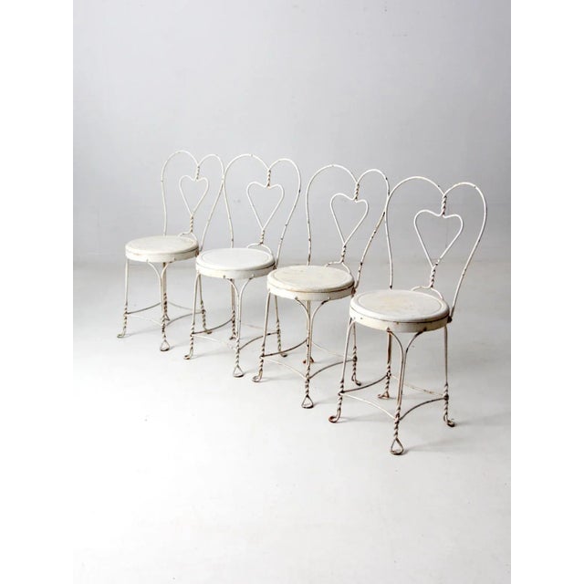 This set of four vintage ice cream parlor chairs is offered from our Heritage Collection. Retaining their original...