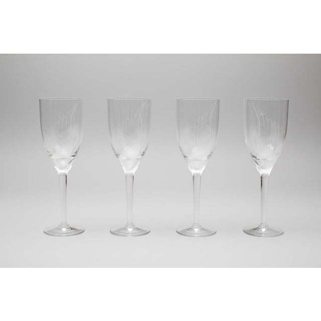 Lalique France set of 4 "Angel" champagne flutes designed in 1948 by Marc Lalique. A classic design featuring an etched...