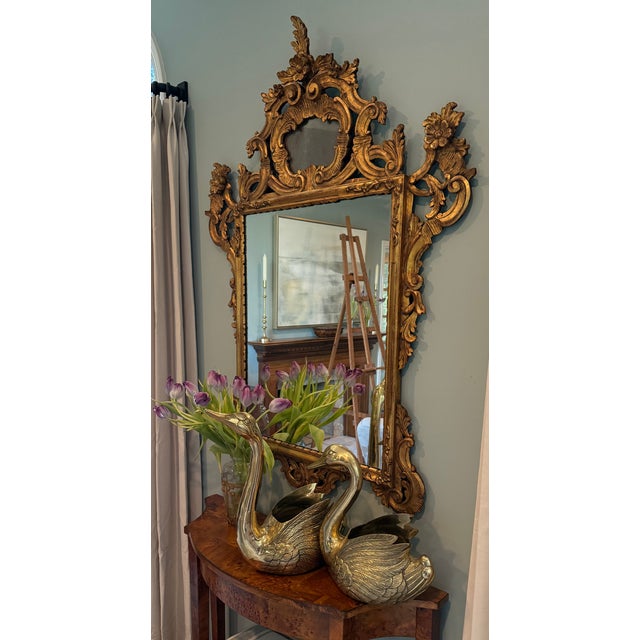 A commanding pair of brass swan planters or cachepots — large and small, necks arched in opposite directions, wings spread...