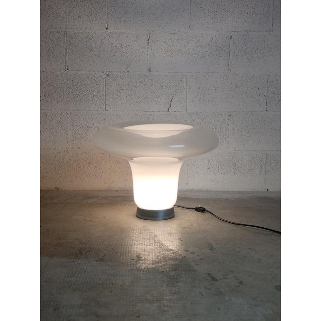 The Lesbo lamp is a symbol of the '' made in Italy '' design of the 70s. It was designed in 1967 by the great architect...