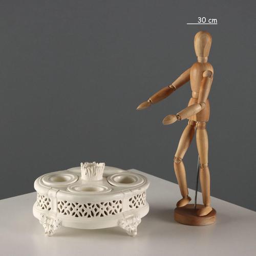 Earthenware inkwell with a shaped and perforated basket. It has space for various items. Leaf-shaped feet. This piece is...