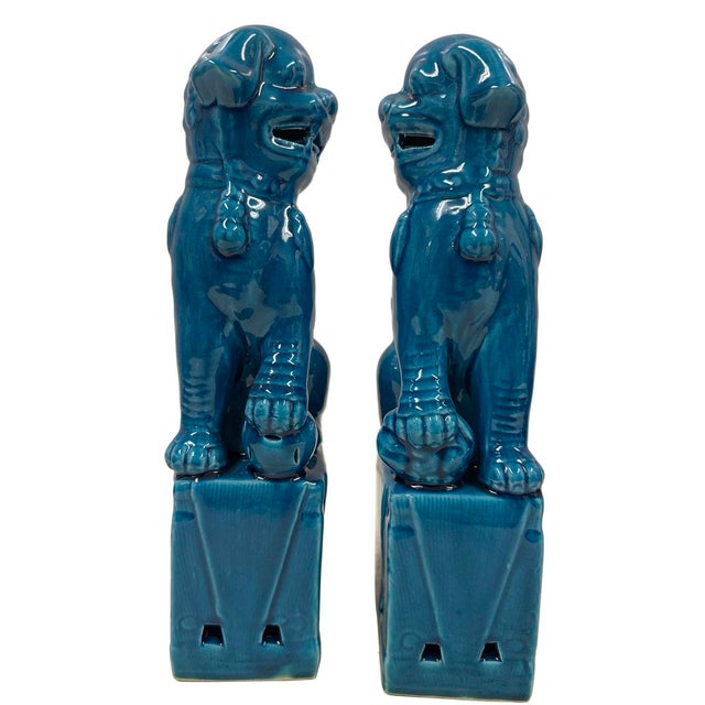 This magnificent pair of Chinese Turquoise Glazed Ceramic Lion Statuary are hand made and hand carved in Museum quality....