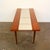 Unusual coffee table with beautiful teak grain and geometric mosaic. The legs are made of solid teak and the top is made...