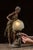 c. 1915-1920s; Anglade - Paris, France Cast metal figural lamp depicting a draped woman leaning toward a stylized well,...