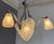 Art Deco chandelier with three tulip shades and a shell-shaped shade, signed Degué (David Guéron: 1892-1950) Circa 1930...