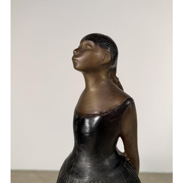 A graceful bronze sculpture of a young ballerina, inspired by the celebrated works of Edgar Degas, whose intimate studies...