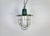 Industrial hanging lamp manufactured in Poland during the 1960s. It features a green enamel shade with white enamel...