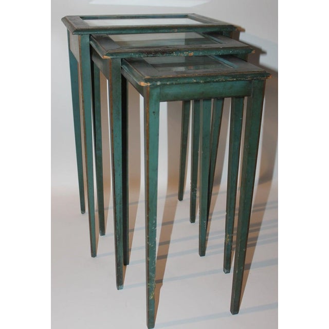 Set of three American original blue painted nesting/side tables with Asian design Measures: Largest- 15 wide x 13 deep x...