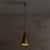A Model 1995 pendant light designed by Max Ingrand for Fontana Arte in the 1960s. The conical brass shade, naturally...