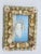 This charming coastal artwork features a small painting of an open oyster shell resting on a sandy shoreline against a...