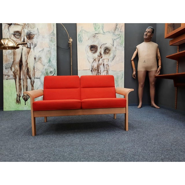 A charming two-seater sofa from the 1970s. An elegant design by Rud Thygesen & Johnny Sørensen. Manufactured by Magnus...
