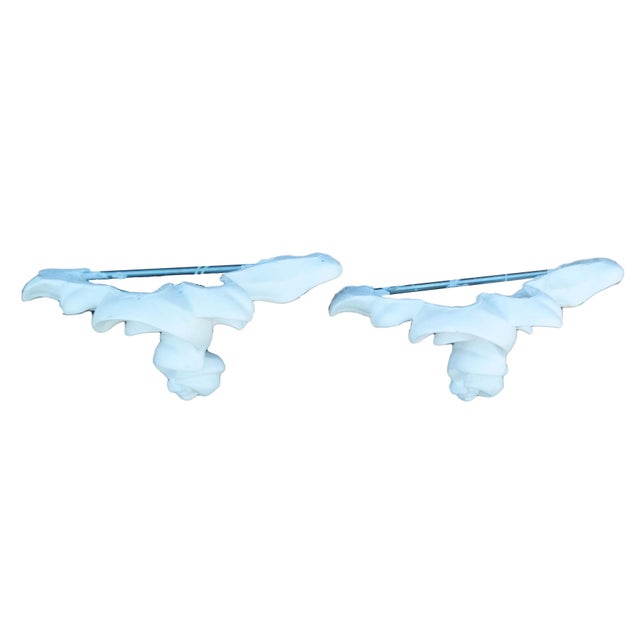 A pair of large white plaster brackets in manner of Serge Roche.