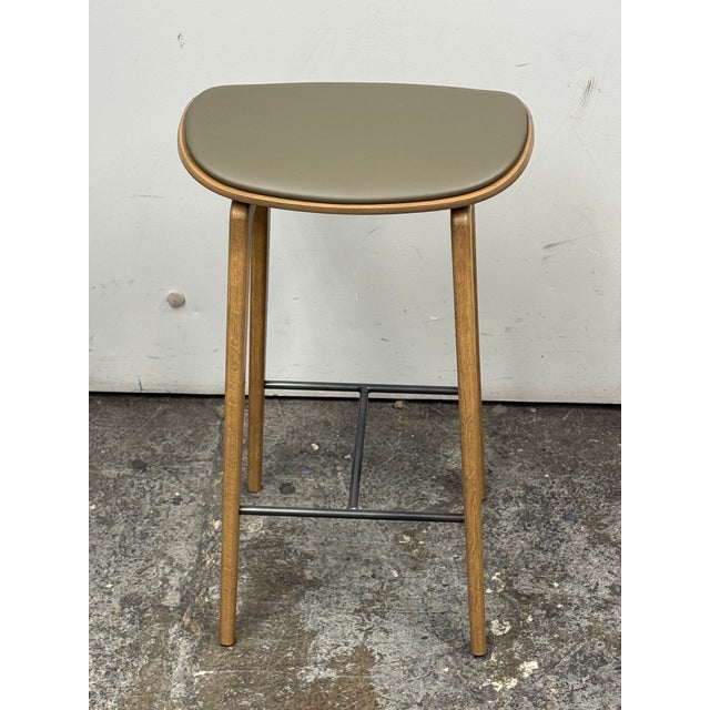 Design Plus Gallery presents the Ny11 Bar Stool from Norr11. The stool has a Light Smoked Oak frame paired with a Spectrum...