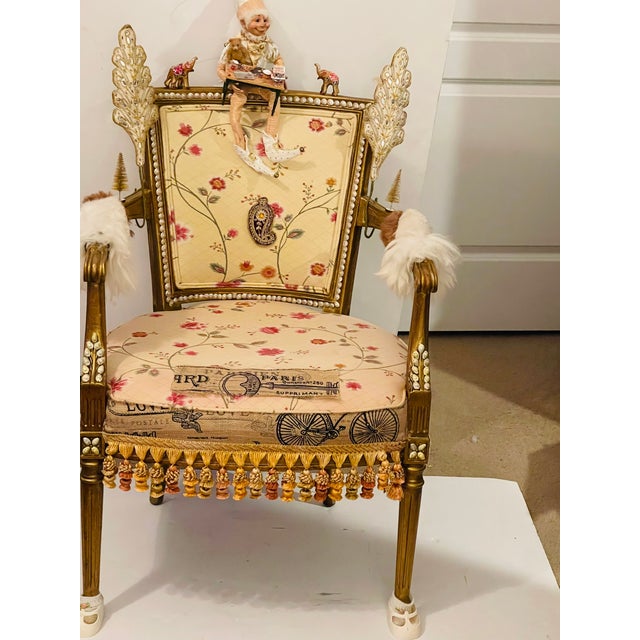 Whimsical Jester Floridus making Christmas cookies armchair designed by Elia.