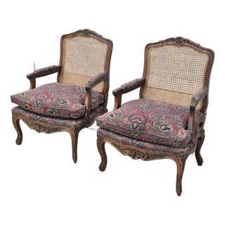 Late 20th Century Louis XV Carved Walnut Cane Back Arm Chairs Fauteuils, a Pair For Sale