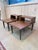 A distinctive pair of vintage Mid-Century Modern step side tables combining clean architectural lines with clever...