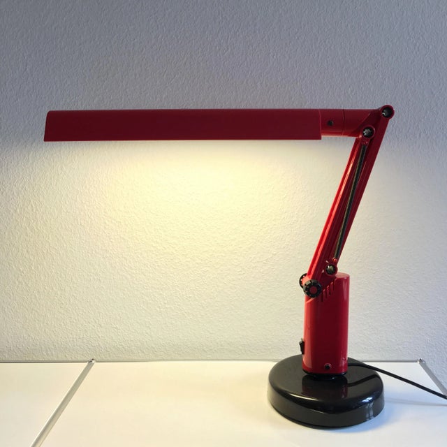 This red Fagerhults Lucifer desk lamp was made in Sweden. Imprinted by Maker,This piece has an attribution mark, I am sure...