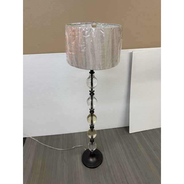 Design Plus Gallery presents a Marston Crystal Floor Lamp from Pottery Barn. It is made of their K9 crystal glass with...