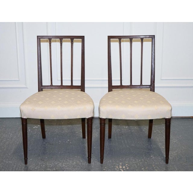 Lovely Pair of Side Dining Chairs with Cream Upholstery. A pair of Victorian side chairs with cream upholstery offers a...