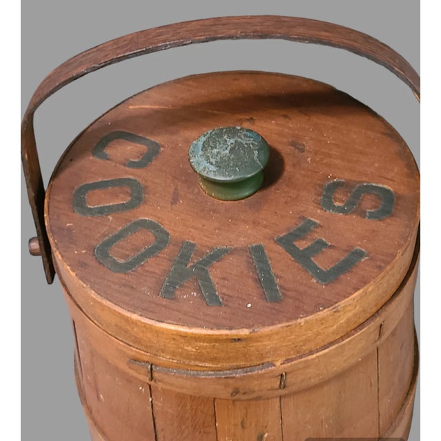This vintage wooden firkin is a charming addition to any collection. With a height of 8 inches and a width of 8.5 inches,...