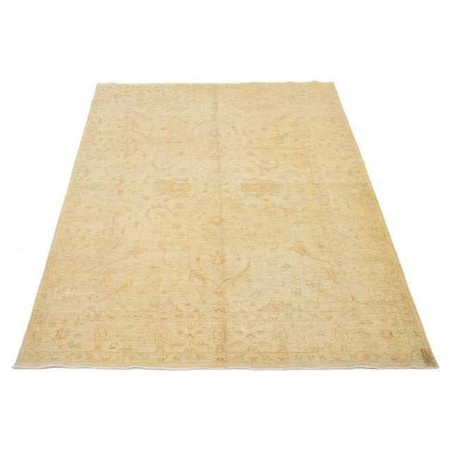 This Hand-Knotted Wool Rug Peshawar has the Beige field with gray and goldenrod, a Floral Pattern. This rug measures 6'7"...