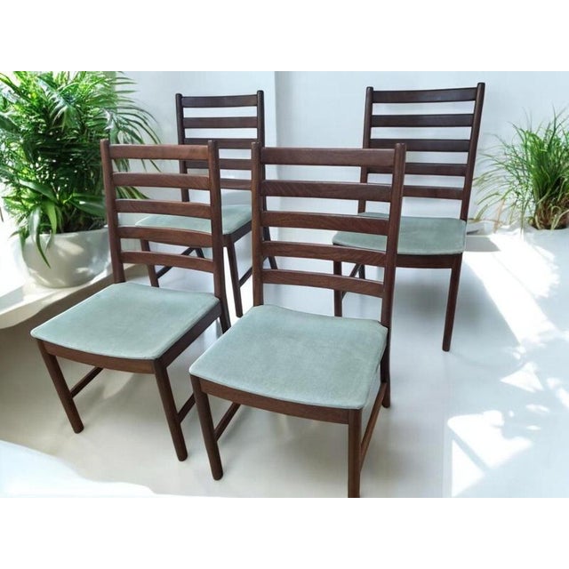 Transform your dining space with this exquisite set of four Mid Century White & Newton vintage dining chairs, impeccably...