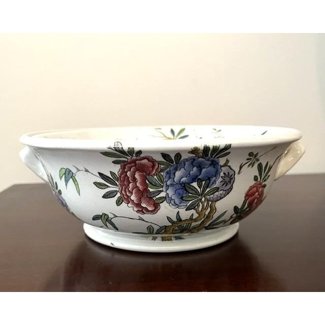 2 piece ceramic berry bowl and strainer made by Copeland Spode for T. Good & Co London early 1890s. It has an Asian...