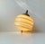 Art Deco hanging lamp featuring a beehive shaped shade in light yellow/beige opaline glass, a suspended wooden sphere and...