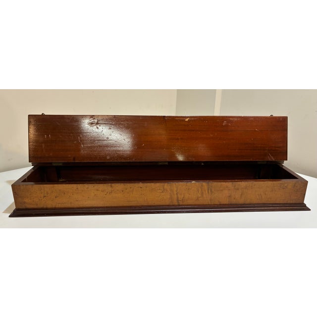 Substantial late 19th-century dresser casket box crafted in richly figured mahogany veneer, featuring an architectural...