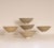 5 Chinese Song Dynasty Celadon Bowls from the Jepara Wreck. The bowls have a sculpted rim and are swiftly Incised with an...
